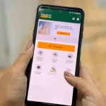Celular com a tela aberta no aplicativo para pagar o IPVA 2026.