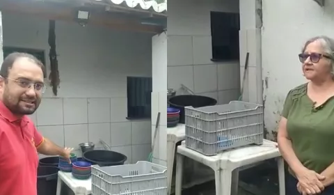 Dois servidores mostrando a cantina da escola municipal em Juazeiro do Norte com precariedade.